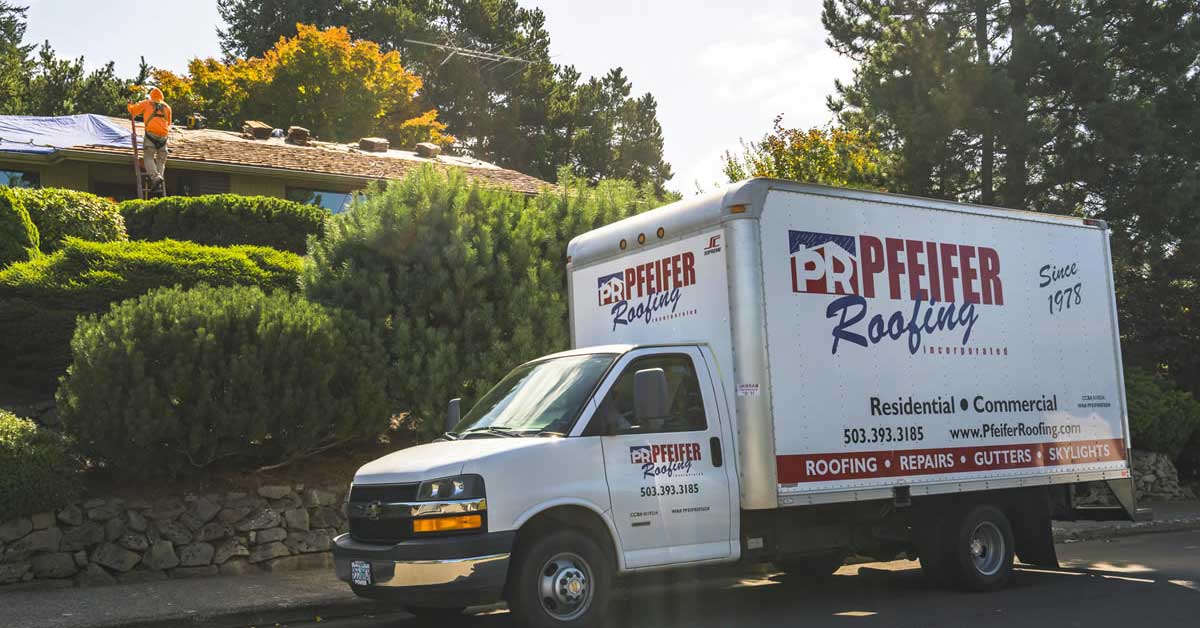 Reroofing behind truck