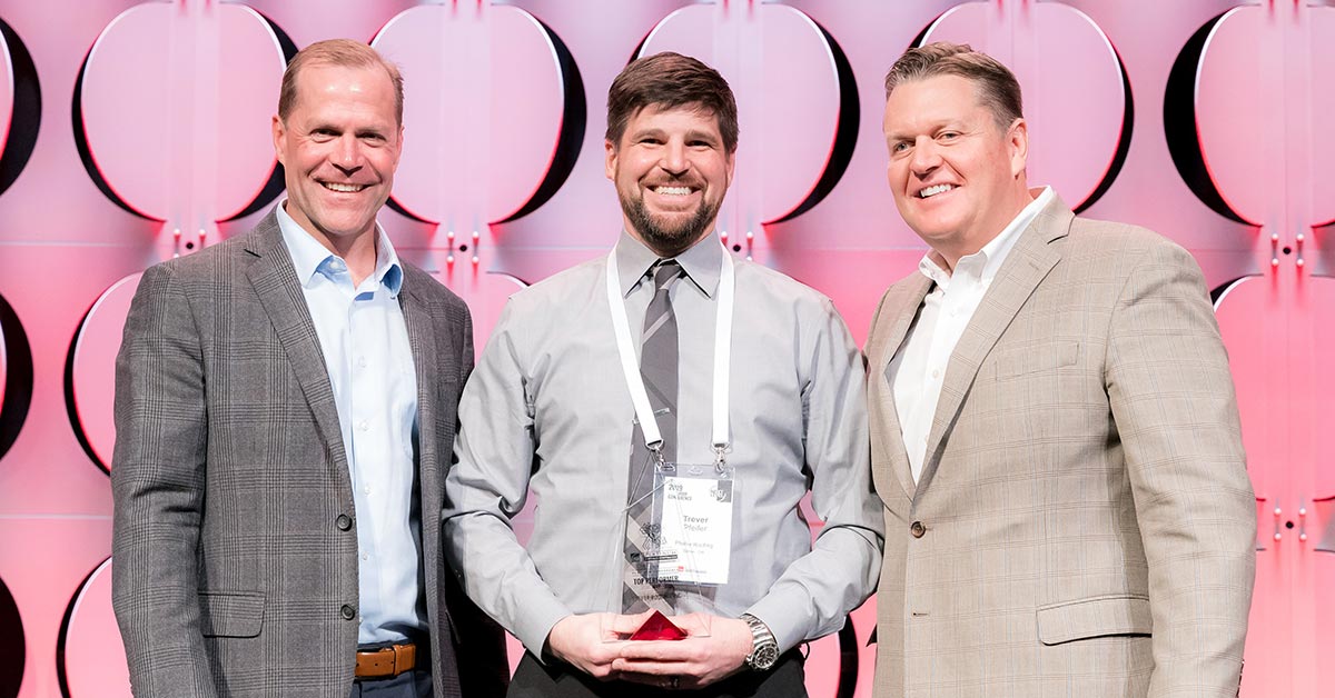 Trever Pfeifer winning an award for excellence